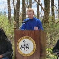 lew at podium